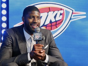 Oklahoma City Thunder forward Paul George speaks to at a rally to introduce him to fans in Oklahoma City, Wednesday, July 12, 2017. (AP Photo/Sue Ogrocki)