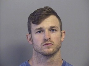 In this Tuesday, July 11, 2017 photo provided by the Tulsa County Sheriffs Office, Benjamin Don Roden is pictured in a booking photo. An arrest report shows Roden faces federal charges after a pipe bomb explosion blew the door off an Air Force recruiting center in the Tulsa area. The report says Roden faces counts of possession of explosive materials and destruction of government property. He was arrested Tuesday, but hasn't been formally charged. (Tulsa County Sheriffs Office via AP)