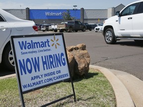 This Tuesday, May 30, 2017, photo shows a sign in the parking lot of a Walmart announcing that the store is hiring, in Oklahoma City. On Tuesday, July 11, 2017, the Labor Department reports on job openings and labor turnover for May. (AP Photo/Sue Ogrocki)