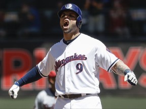 Milwaukee Brewers' Manny Pina reacts after hitting a two-run scoring double during the second inning of a baseball game against the Baltimore Orioles Monday, July 3, 2017, in Milwaukee. (AP Photo/Morry Gash)