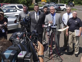 Bucks County District Attorney Matthew Weintraub briefs reporters at a news conference in Solebury Township, Pa., about the investigation into the disappearance of four men Monday, July 10, 2017. Weintraub identifies the missing men, who went missing last week, as Mark Sturgis, of Pennsburg; Tom Meo, of Plumstead; Dean Finocchiario, of Middletown; and Jimi Tar Patrick, of Newtown Township. (Bill Fraser/The Intelligencer via AP)