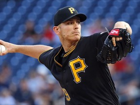 Pittsburgh Pirates starting pitcher Chad Kuhl winds up during the first inning of the team's baseball game against the Milwaukee Brewers in Pittsburgh, Monday, July 17, 2017. (AP Photo/Gene J. Puskar)