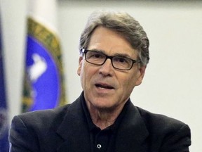 Department of Energy Secretary Rick Perry talks with employees during a visit to the National Energy Technology Laboratory (NETL) Pittsburgh site, Friday, July 7, 2017, in South Park Township, Pa., south of Pittsburgh. (AP Photo/Keith Srakocic)