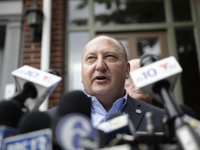 Allentown Mayor Edwin Pawlowski speaks with members of the media outside of his home in Allentown, Pa., Wednesday, July 26, 2017. Pawlowski and the former mayor of Reading have been indicted on federal corruption charges for engaging in a series of pay-to-play schemes where the politicians shook down businesses and individuals for campaign contributions in exchange for political favors, according to court papers released Wednesday. (AP Photo/Matt Rourke)