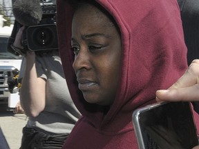 FILE- In this April 1, 2016, file photo, Cherie Amoore is surrounded by the media as she arrives at District Justice William Maruszcak' court Friday, April 1, 2016, in Upper Merion, Pa., for her arraignment in connection to the kidnapping of a 7-week-old at the King of Prussia Mall in Upper Merion, Pa. Amoore, who was convicted in March of kidnapping and child concealment in the March 2016 events at the mall, was sentenced to 1½ to seven years in prison on Monday, July 24, 2017. (Gene Walsh/The Times Herald via AP, File)