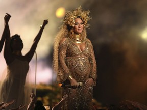 FILE - This Feb. 12, 2017, file photo shows Beyonce performing at the 59th annual Grammy Awards in Los Angeles. Beyonce debuted her newborn twins Sir Carter and Rumi in an Instagram post on July 13, 2017. (Photo by Matt Sayles/Invision/AP, File)