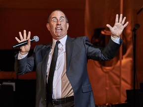 FILE - In this Nov. 4, 2015, file photo Jerry Seinfeld performs at the David Lynch Foundation Benefit Concert at Carnegie Hall in New York. Forbes announced on July 27, 2017, that Seinfeld is the highest paid comedian over the past year, bringing in $69 million. (Photo by Robert Altman /Invision/AP, File)