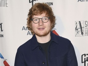 FILE - In this June 15, 2017, file photo, Ed Sheeran attends the the 48th Annual Songwriters Hall of Fame Induction and Awards Gala at the New York Marriott Marquis Hotel in New York. Sheeran posted an on-set picture on July 16, 2017, following his 'Game of Thrones' cameo in which the 26-year-old British singer appeared as a Lannister soldier in the season premiere of the hit HBO fantasy drama, which debuted on the premium cable channel Sunday night. (Photo by Evan Agostini/Invision/AP, File)