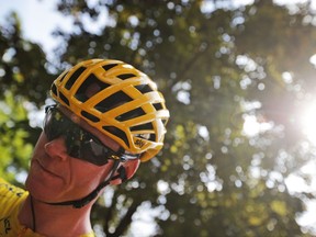 Britain's Chris Froome, wearing the overall leader's yellow jersey, waits for the starts of the seventh stage of the Tour de France cycling race over 213.5 kilometers (132.7 miles) with start in Troyes and finish in Nuits-Saint-Georges, France, Friday, July 7, 2017. (AP Photo/Christophe Ena)