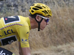 Britain's Chris Froome, wearing the overall leader's yellow jersey, climbs during the nineteenth stage of the Tour de France cycling race over 222.5 kilometers (138.3 miles) with start in Embrun and finish in Salon-de-Provence, France, Friday, July 21, 2017. (AP Photo/Christophe Ena)