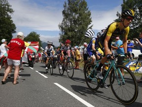 New Zealand's George Bennett, right, is followed by Ireland's Daniel Martin, South Africa's Louis Meintjes, and Britain's Simon Yates, wearing the best young rider's white jersey, during the twelfth stage of the Tour de France cycling race over 214.5 kilometers (133.3 miles) with start in Pau and finish in Peyragudes, France, Thursday, July 13, 2017. (AP Photo/Peter Dejong)
