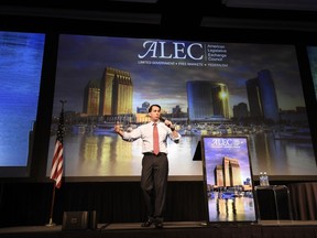 FILE--In this July 23, 2015, file photo, Republican presidential candidate Wisconsin Gov. Scott Walker speaks at the American Legislative Exchange Council 42nd annual meeting in San Diego, Calif. For four decades, the well-funded conservative group, ALEC, has helped write legislation to help sympathetic state lawmakers rein in unions, expand charter schools and limit taxes. Now they're trying to expand to the final frontiers of government, traditionally nonpartisan city councils, which have become a bastion of liberal resistance to Donald Trump. (AP Photo/Denis Poroy, file)