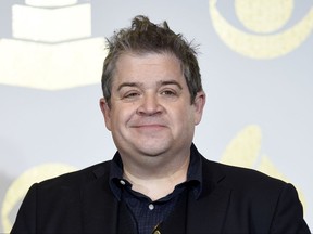 FILE - In this Feb. 12, 2017 file photo, Patton Oswalt poses in the press room with the award for best comedy album for "Talking for Clapping" at the 59th annual Grammy Awards in Los Angeles. Fifteen months after the death of his wife, Oswalt is engaged to marry actress Meredith Salenger, His publicist confirmed Thursday, July 6.  Michelle McNamara, a writer, died in April 2016 from a combination of prescription medications and an undiagnosed heart condition. (Photo by Chris Pizzello/Invision/AP, File)