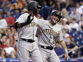 Pittsburgh Pirates' Gregory Polanco, left, and Francisco Cervelli react after scoring on a two-run single by Gerrit Cole during the fourth inning of the team's baseball game against the Philadelphia Phillies, Wednesday, July 5, 2017, in Philadelphia. (AP Photo/Matt Slocum)