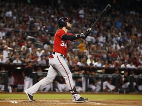 Washington Nationals' Bryce Harper watches the flight of his home run against the Arizona Diamondbacks during the first inning of a baseball game Saturday, July 22, 2017, in Phoenix. (AP Photo/Ross D. Franklin)