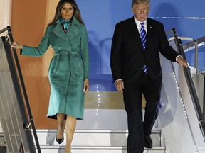 President Donald Trump and the first lady Melania Trump exit Air force One upon their arrival in Warsaw, Poland, Wednesday, July 5, 2017. President Trump arrived in Poland ahead of an outdoor address in Warsaw on Thursday and energy talks with European leaders. (AP Photo/Czarek Sokolowski)