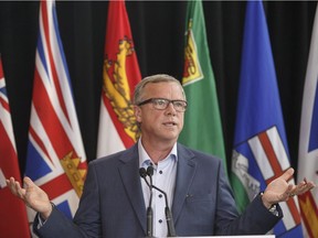 Saskatchewan Premier Brad Wall speaks to media during the Council of Federation meetings in Edmonton Alta, on Tuesday July 18, 2017. THE CANADIAN PRESS/Jason Franson ORG XMIT: EDM118