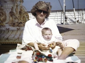 A photo taken by Prince William shows the princess sitting and playing with Prince Harry aboard the Royal Yacht Britannia. T