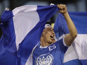 An El Salvador fan cheers before a CONCACAF Gold Cup quarterfinal soccer match against the United States, in Philadelphia, Wednesday, July 19, 2017. (AP Photo/Matt Rourke)