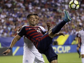 United States' Clint Dempsey (28) is defended by El Salvador's Henry Romero (4) during a CONCACAF Gold Cup quarterfinal soccer match in Philadelphia, Wednesday, July 19, 2017. (AP Photo/Matt Rourke)