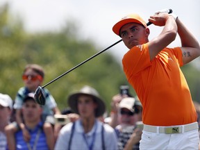 Rickie Fowler watches his shot on the second tee during the Quicken Loans National golf tournament, Sunday, July 2, 2017, in Potomac, Md. (AP Photo/Alex Brandon)