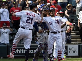 Chicago White Sox's Yolmer Sanchez (5) is greeted by Todd Frazier (21) after hitting a two-run home run against the Texas Rangers during the eighth inning of a baseball game, Sunday, July 2, 2017, in Chicago. (AP Photo/David Banks)