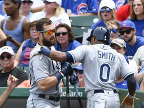 Tampa Bay Rays Mallex Smith (0) celebrates with Steven Souza Jr. (20), left, after scoring during the first inning of a baseball game against the Chicago Cubs on Wednesday, July 5, 2017, in Chicago. (AP Photo/Matt Marton)