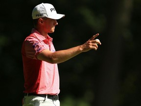 Mackenzie Hughes reacts to his putt on the 13th hole at the Canadian Open on July 30.