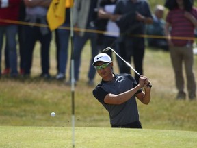 China's Haotong Li plays out of a bunker on the 4th hole during the third round of the British Open Golf Championship, at Royal Birkdale, Southport, England, Saturday July 22, 2017. (AP Photo/Dave Thompson)