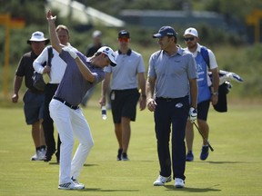 England's Justin Rose, left, warms up during a practice round with England's Nick Faldo ahead of the British Open Golf Championship, at Royal Birkdale, Southport, England Tuesday, July 18, 2017. (AP Photo/Dave Thompson)