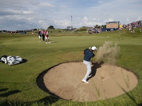 Brooks Koepka of the United States plays out of a bunker on the 7th green during the third round of the British Open Golf Championship, at Royal Birkdale, Southport, England, Saturday July 22, 2017. (AP Photo/Alastair Grant)