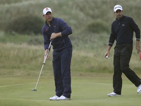 South Africa's Shaun Norris, left, and England's Richard Blande prepare to putt on the 7th hole during the second round of the British Open Golf Championship, at Royal Birkdale, Southport, England, Friday July 21, 2017. (AP Photo/Peter Morrison)