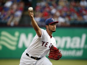 Texas Rangers starting pitcher Yu Darvish (11) pitches against the Boston Red Sox during the first inning of a baseball game Tuesday, July 4, 2017, in Arlington, Texas. (AP Photo/Michael Ainsworth)
