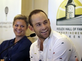 Tennis Hall of Fame inductees Kim Clijsters of Belgium and Andy Roddick of the United States laugh during a news conference before enshrinement ceremonies at the International Tennis Hall of Fame, Saturday, July 22, 2017, in Newport, R.I. (AP Photo/Elise Amendola)