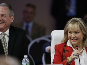 Oklahoma Republican Gov. Mary Fallin and South Dakota Republican Gov. Dennis Daugaard, left, laugh as Fallin addresses a plenary session entitled "The Workforce of Tomorrow" on the third day of the National Governors Association's meeting Saturday, July 15, 2017, in Providence, R.I. (AP Photo/Stephan Savoia)