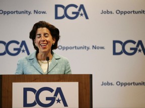 Rhode Island Gov. Gina Raimondo smiles as she addresses a Democratic Governors joint news conference during the National Governor's Association meeting to highlight the damaging impact they contend the pending Senate health care bill would have on their states at the second day of the NGA meeting Friday, July 14, 2017, in Providence, R.I. (AP Photo/Stephan Savoia)