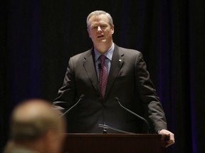 Massachusetts Republican Gov. Charlie Baker opens a session called "Curbing The Opioid Epidemic" at the first day of the National Governor's Association meeting Thursday, July 13, 2017, in Providence, R.I. (AP Photo/Stephan Savoia)