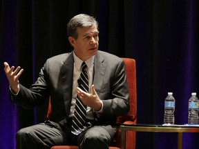 North Carolina Democratic Gov. Roy Cooper participates in a panel discussion during a session called "Curbing The Opioid Epidemic" at the first day of the National Governor's Association meeting Thursday, July 13, 2017, in Providence, R.I. (AP Photo/Stephan Savoia)