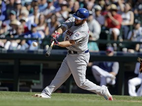 Kansas City Royals' Mike Moustakas hits a two-RBI home run on a pitch from Seattle Mariners' Felix Hernandez during the fourth inning of a baseball game, Tuesday, July 4, 2017, in Seattle. (AP Photo/John Froschauer)