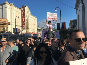 Protesters listen to speakers at a demonstration against a proposed ban of transgendered people in the military in the Castro District, Wednesday, July 26, 2017, in San Francisco. Demonstrators flocked to a plaza named for San Francisco gay-rights icon Harvey Milk to protest President Donald Trump's abrupt ban on transgender troops in the military. (AP Photo/Olga R. Rodriguez)