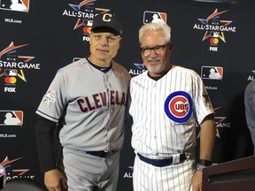 American League manager Brad Mills, of the Cleveland Indians, and National League manager Joe Maddon pose during a press conference for the All-Star game in Miami, Monday, July 10, 2017. (AP Photo/Ron Blum