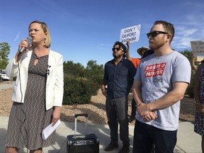 Immigration attorney Rebecca Kitson, left, and ACLU New Mexico spokesman Micah McCoy, right, speak in support of Iraqi refugee Kadhim Al-bumohammed outside of Immigration and Customs Enforcement offices in Albuquerque on Thursday, July 13, 2017. Al-bumohammed opted to skip his scheduled federal immigration hearing Thursday where he was expected to be detained, and instead said he is seeking sanctuary at an Albuquerque church. (AP Photo/Russell Contreras)