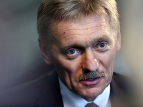 Kremlin press secretary Dmitry Peskov talks to a reporter in New York, Thursday, Nov. 10, 2016