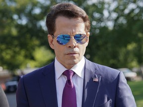 In this July 25, 2017, photo, White House communications director Anthony Scaramucci walks back to the West Wing of the White House in Washington