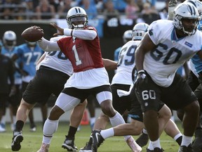 Carolina Panther quarterback Cam Newton (1) looks to throw a pass during practice at NFL football training camp at Wofford College in Spartanburg, S.C., Wednesday, July 26, 2017. (AP Photo/Chuck Burton)