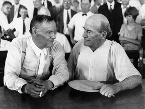 In this July 1925 photo, Clarence Darrow, left, and William Jennings Bryan speak with each other during the monkey trial in Dayton, Tenn.
