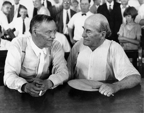 In this July 1925 photo, Clarence Darrow, left, and William Jennings Bryan speak with each other during the monkey trial in Dayton, Tenn.