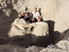 Dr. Peter Houde, a biology professor at New Mexico State University, sitting with the Sparks brothers during the excavation of the fossilized skull of a Stegomastodon in Las Cruces, N.M., in May.