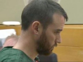 In this image made from a video provided by Q13 News, Cameron Espitia, who is accused of fatally shooting his wife Jennifer Espitia, makes an appearance in a King County courtroom in Seattle, Monday, July 3, 2017. Police say Jennifer Espitia was killed early Sunday in Seattle's Queen Anne neighborhood during an argument with Cameron Espitia while in a ride-hailing vehicle. (Bill Bushmaker/Q13 News via AP)