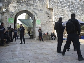 Israeli police officers stand outside the Al Aqsa Mosque compound in Jerusalem's Old City, Tuesday, July 25, 2017. Israel has begun dismantling metal detectors it installed a week earlier at the gates of a contested Jerusalem shrine, amid widespread Muslim protests. (AP Photo/Oded Balilty)